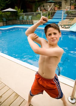 Boy showing off his bicep