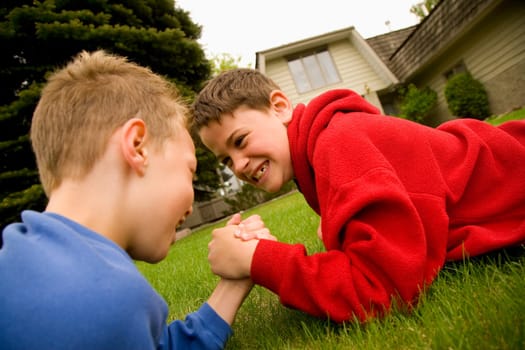 Children arm wrestling