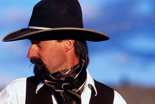 Close-up profile portrait of cowboy