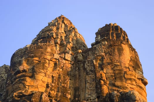 Stone heads on gate Angkor Thom, Siem Reap Cambodia