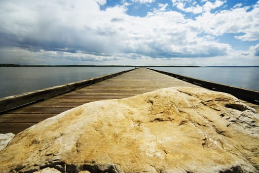 Wooden pier and rock