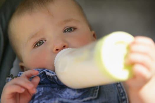 Baby feeding from bottle