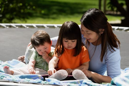 A mother reading to her children
