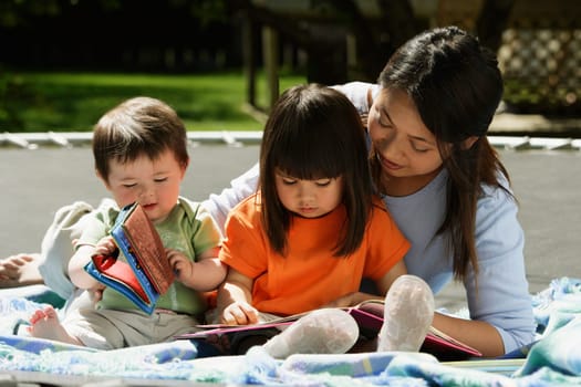 A mother reading to her children