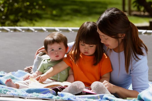 A mother reading to her children