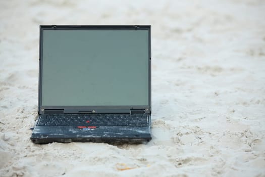 Laptop in the sand