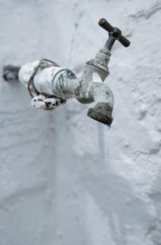 Old tap leaking water