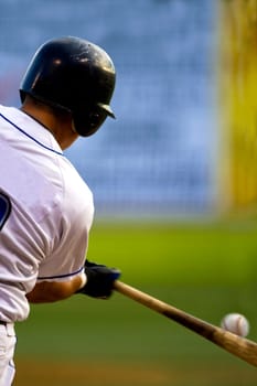 Rear view of a baseball player at bat