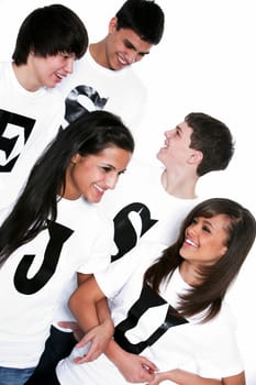 Five teenagers with t-shirts spelling Jesus