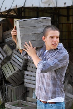 Man moving wooden crate