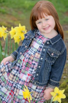 Little girl with daffodils
