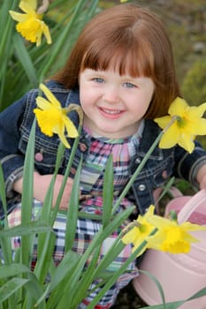 Little girl with daffodils