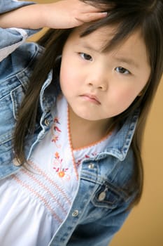 Young girl frowning