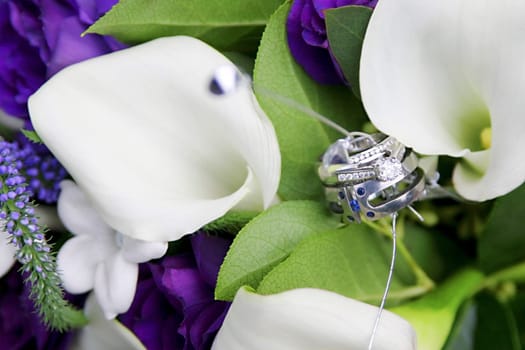 Wedding rings in flowers