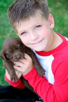 Boy holding puppy