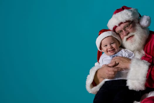 Portrait of Santa with a baby