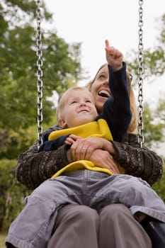 Mother and son on a swing