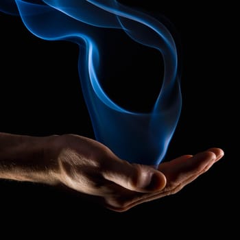 Smoke wisps from a hand