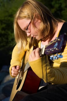 Teen playing guitar