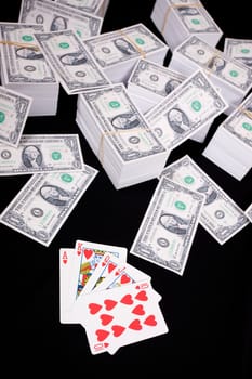 Piles of money and playing cards
