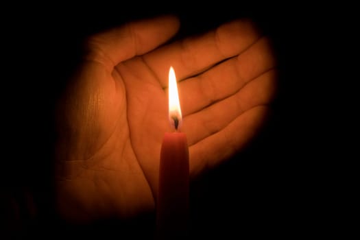 Hand and candle