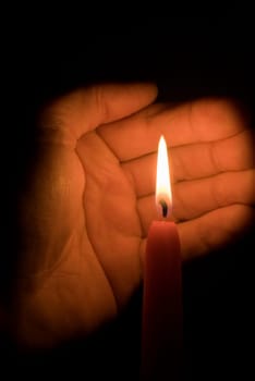 Hand and candle