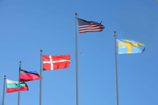 Flags of Bulgaria, Liechtenstein, Denmark, United States and Sweden Flags flapping in the wind