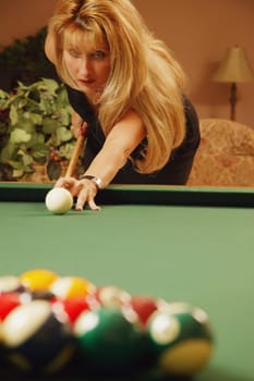 Woman playing pool
