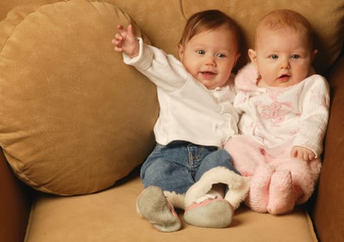 Two babies sitting together