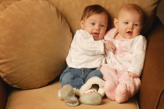 Two babies sitting together