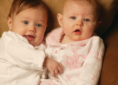 Two babies cuddling