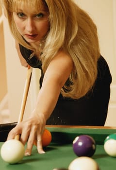 Woman playing pool