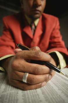 Businessman reading the journal
