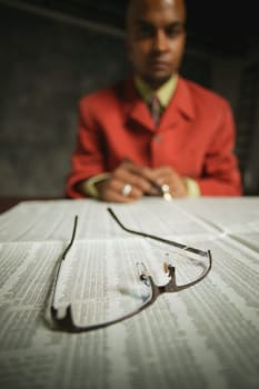 Businessman reads journal