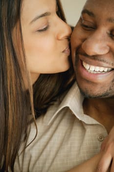 Woman kisses man