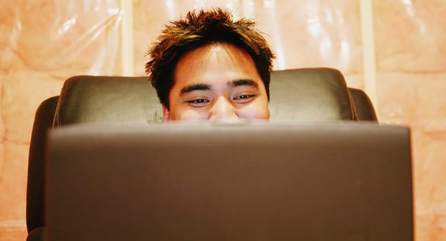 Teenager sits in a room