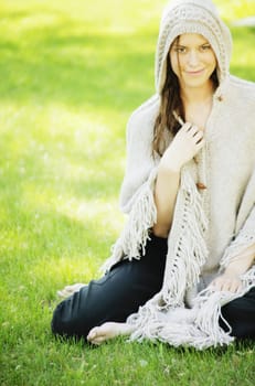 Woman wearing a knit cape