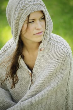 Woman wearing a knit cape