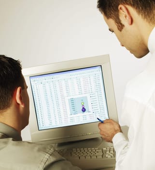 Two men working on computer