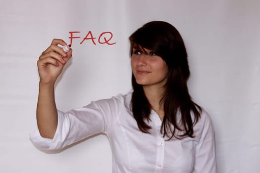 Young woman writes faq