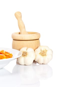 Pasta, garlics and wooden mortar