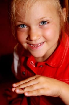Young,blond girl with ladybug