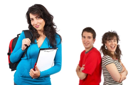 Three students with books and backpacks