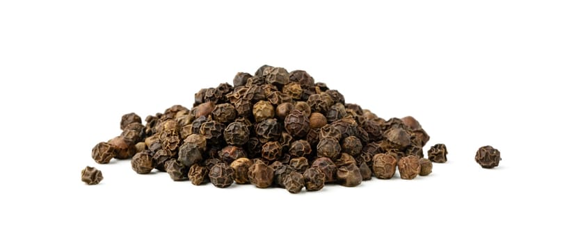 Pile of black peppercorns isolated on white background close up