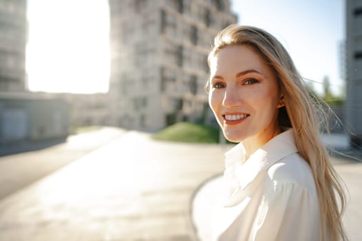 Close up portrait of young blonde businesswoman outdoors