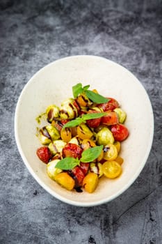 salad of yellow and red cherry tomatoes of different varieties
