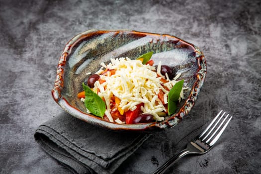 salad with tomatoes, basil, sweet peppers and cheese