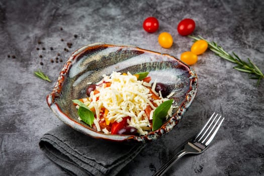 salad with tomatoes, basil, sweet peppers and cheese