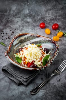 salad with tomatoes, basil, sweet peppers and cheese