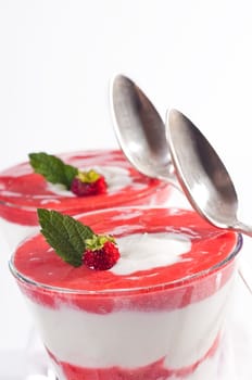 Strawberry curd or strawberry yoghurt in a jar with layers of strawberry sauce